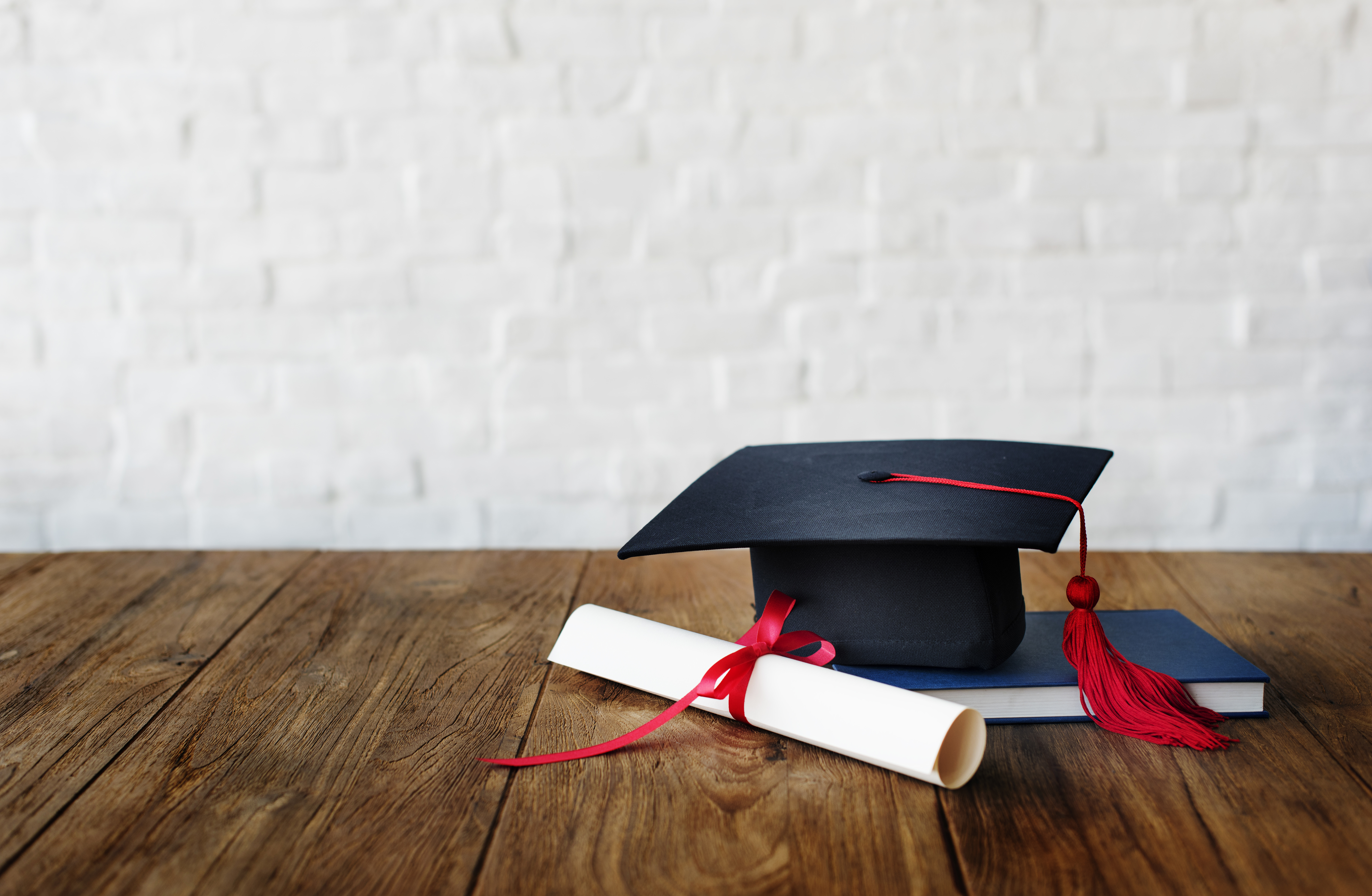 Mortar Board And A Graduation Diploma